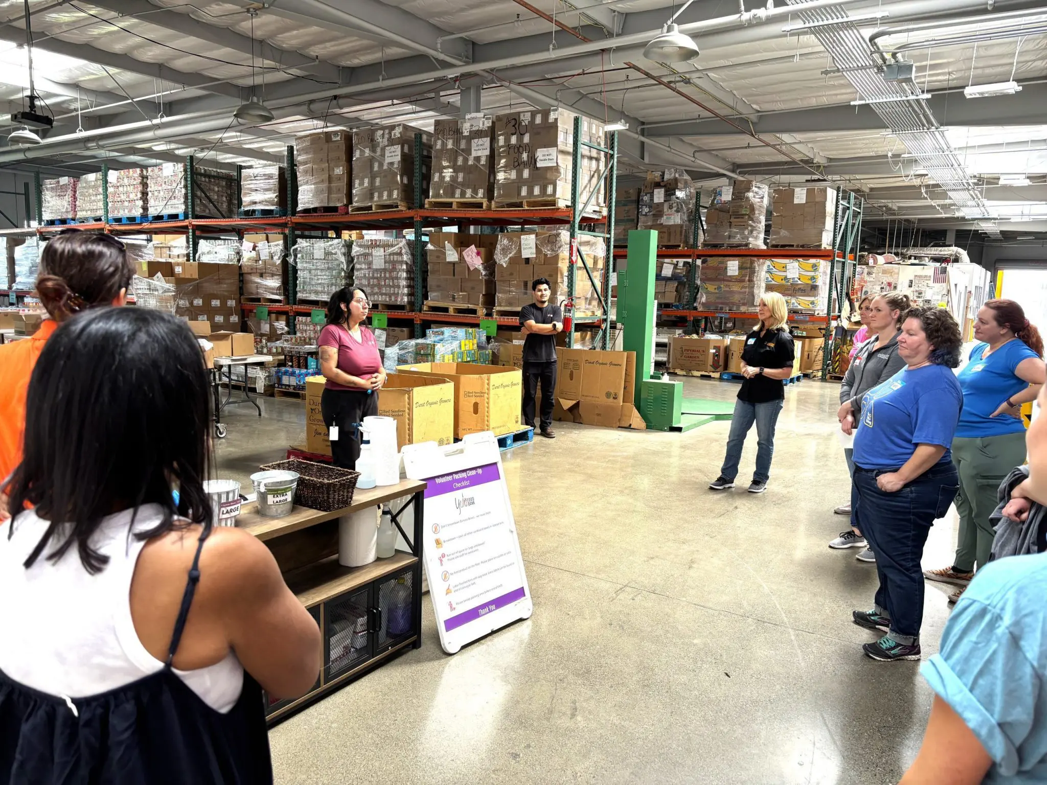 Yolo Food Bank orients Sacramento Region Community Foundation staff, board, and Impact Collaborative members before volunteering begins